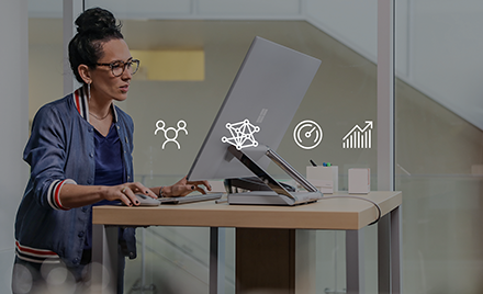 Image of a worker at her workstation.